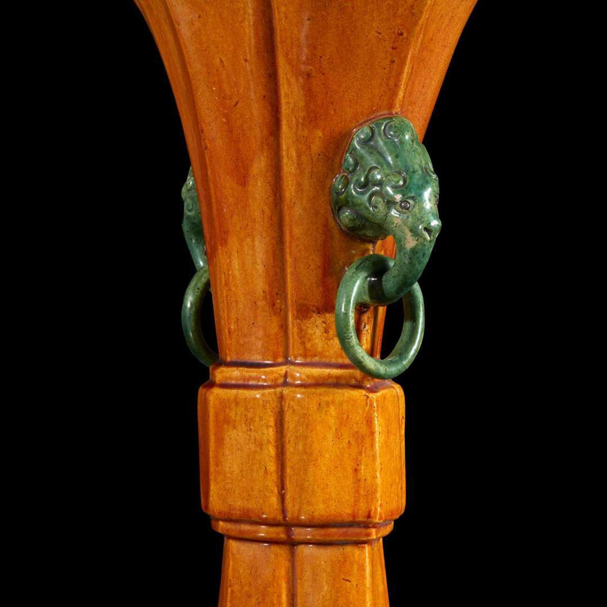 A pair of Chinese yellow-glazed bottle vases and a yellow-glazed gu-form vase 黄釉瓷瓶及木底座两对和黄釉觚式花瓶一件