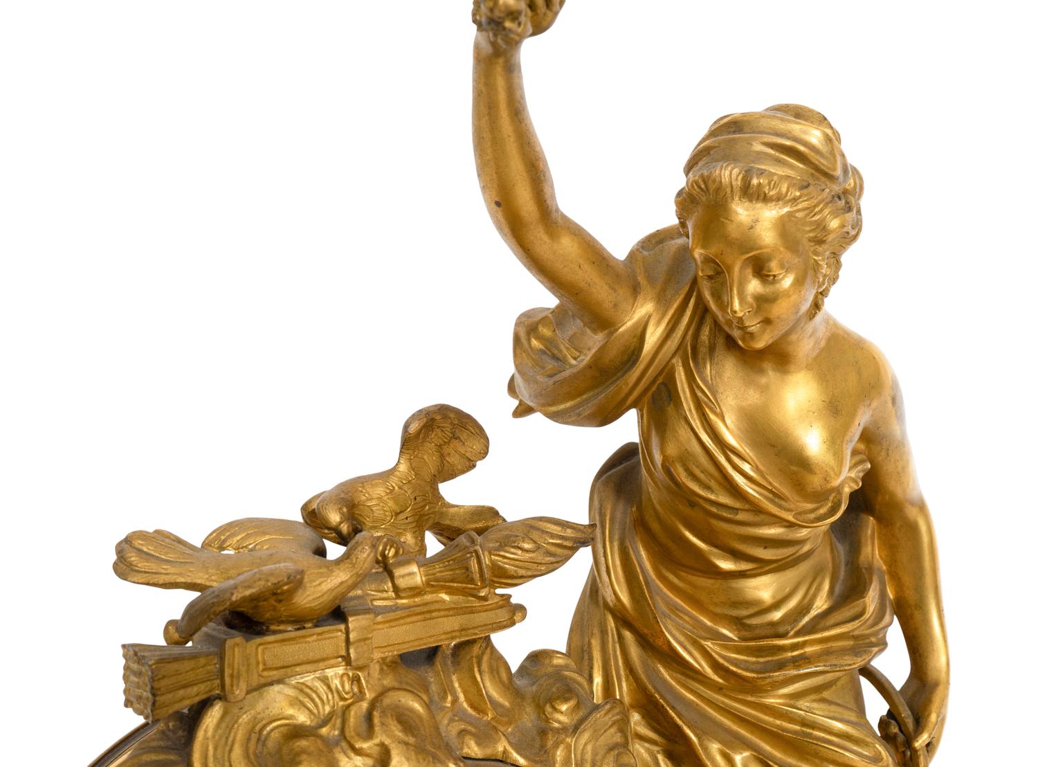 A Napoleon III Marble and Gilt Bronze Mounted Mantel Clock