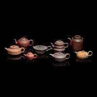 A Group of Eight Assorted Yixing Zisha Stoneware Teapots 宜興紫砂茶壺八件