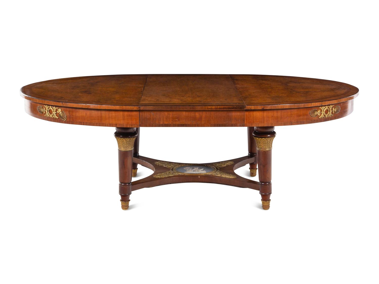 A French Gilt Bronze and Jasperware Mounted Burlwood Dining Suite