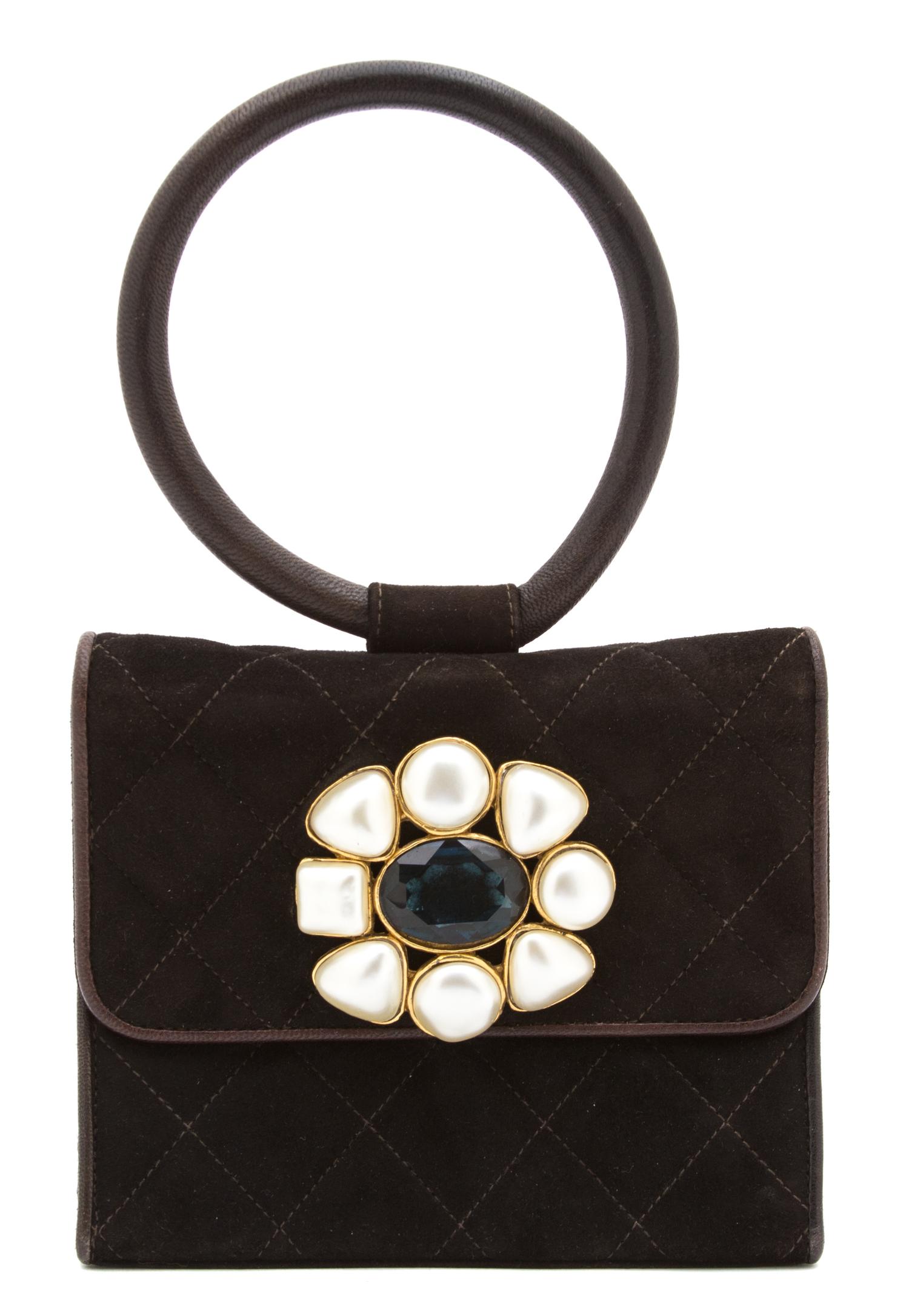 A Chanel Brown Suede Quilted Mini Flap Bag, 6" x 5" x 1.5".