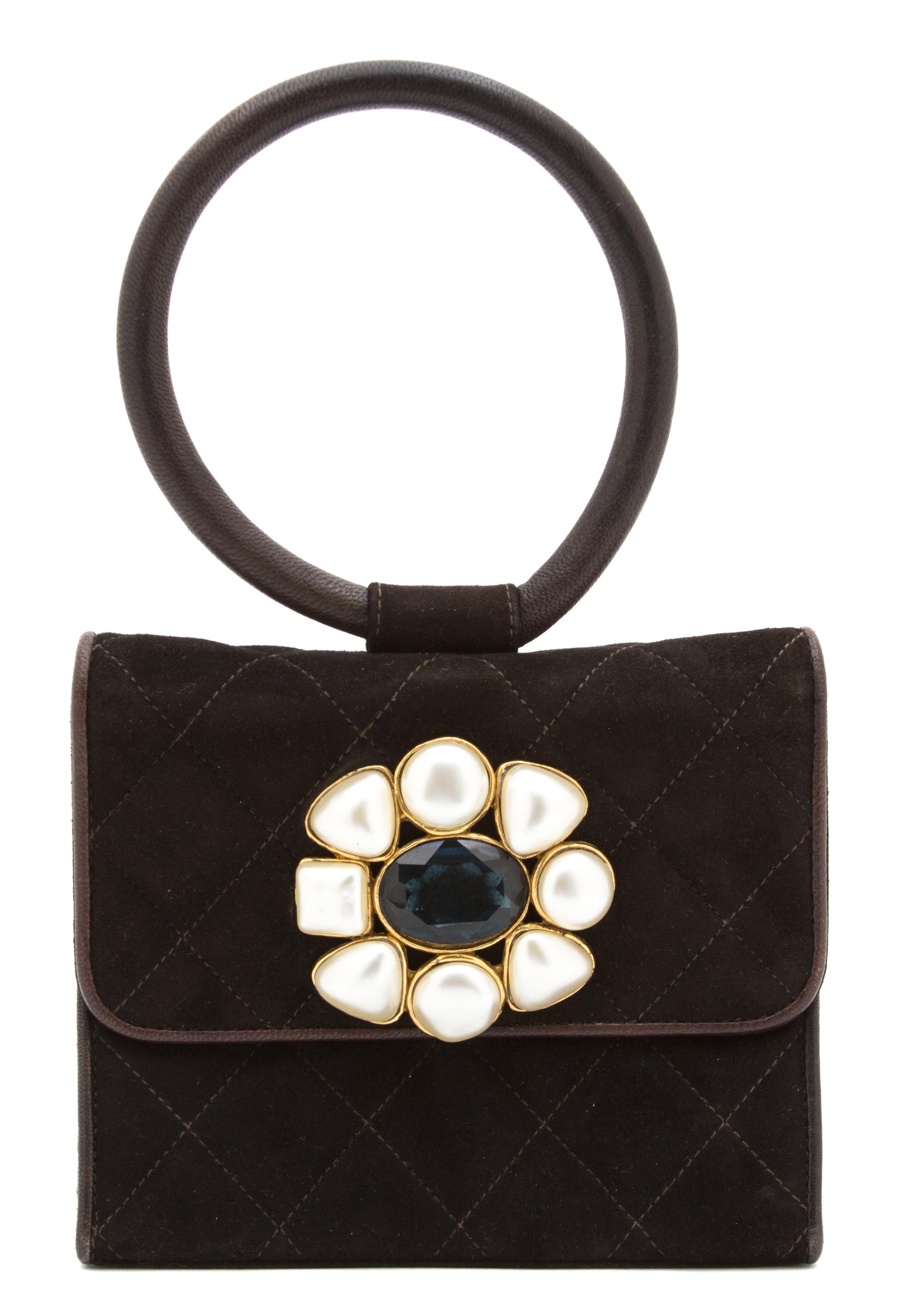 A Chanel Brown Suede Quilted Mini Flap Bag, 6" x 5" x 1.5".