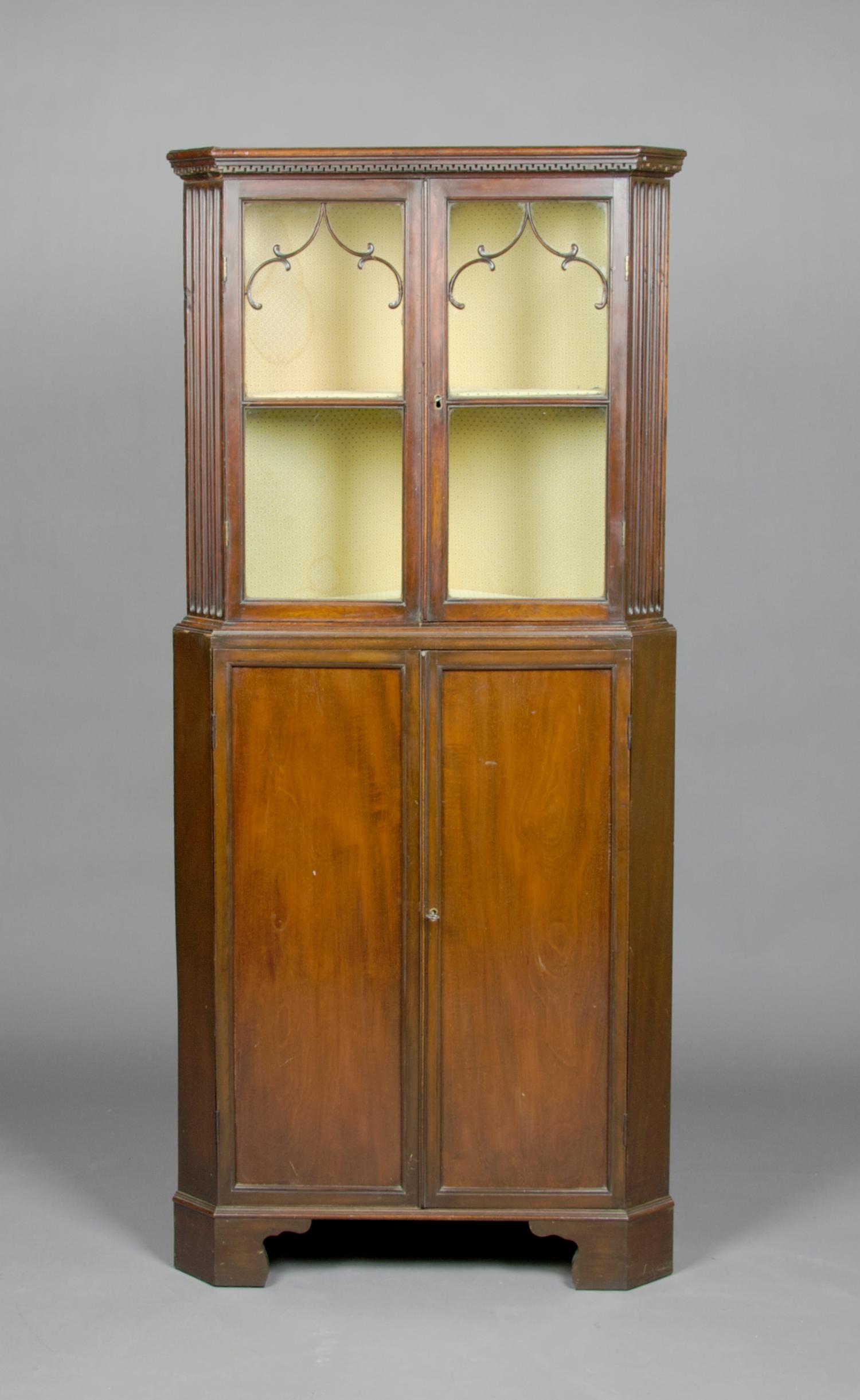 A Georgian Diminutive Corner Cabinet, Height 61 1/2 x width 27 x depth 15 3/4 inches.