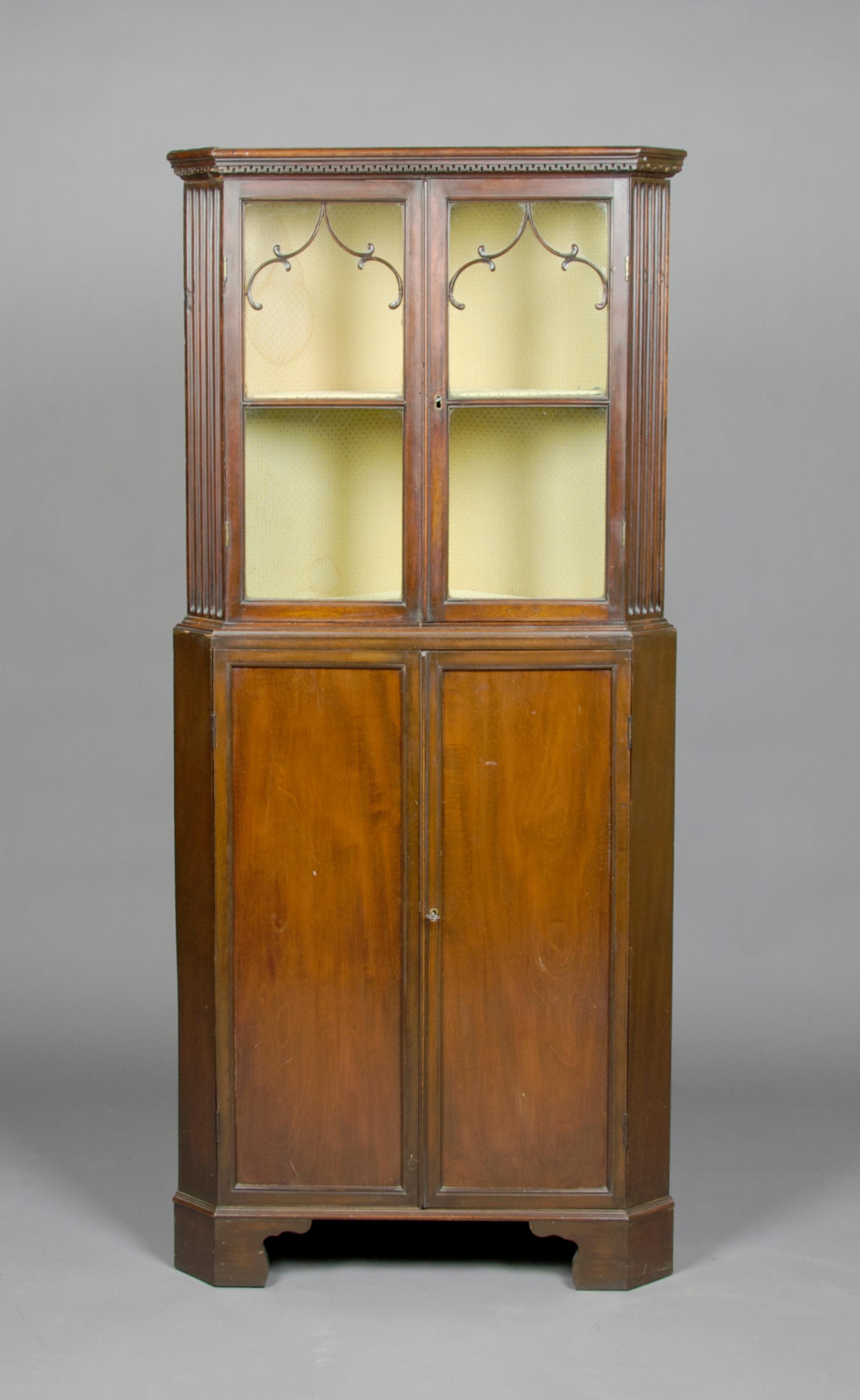 A Georgian Diminutive Corner Cabinet, Height 61 1/2 x width 27 x depth 15 3/4 inches.