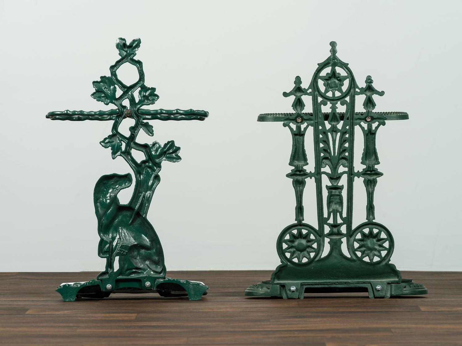 Two Green Painted Cast-Iron Umbrella Stands