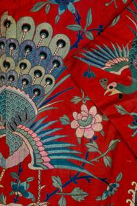 A Chinese Red Ground and Embroidered Silk 'Peacock' Robe