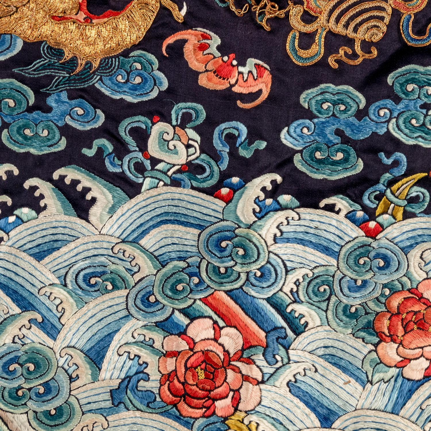 A Chinese Black Ground Embroidered Silk 'Dragon' Court Robe, Chaofugua, 19th Century 清晚期 黑緞地綉云龍紋朝服褂