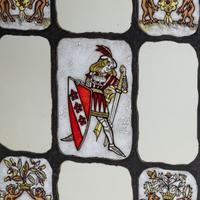 Nine-panel window depicting knight