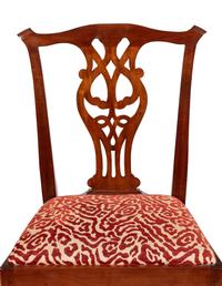 A Set of Twelve Joseph Gaar Dining Chairs