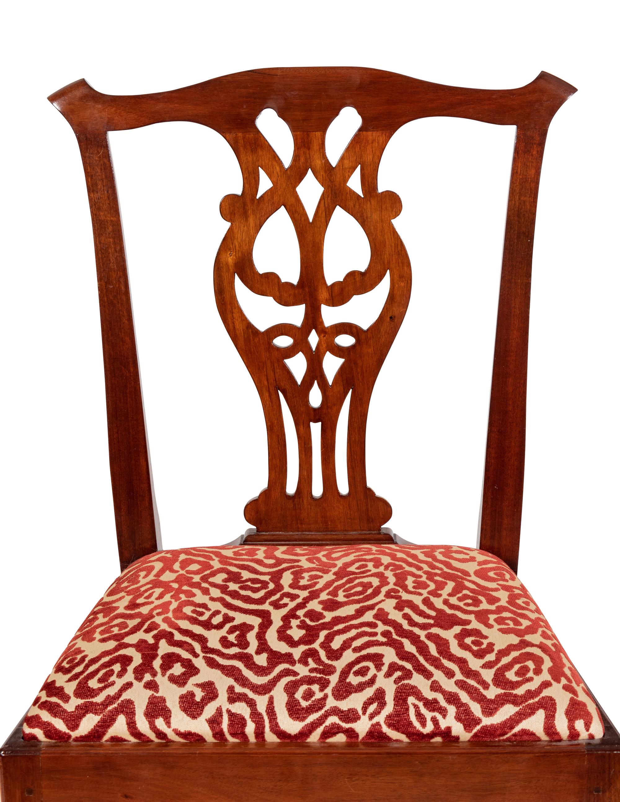 A Set of Twelve Joseph Gaar Dining Chairs