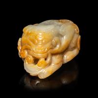 A Chinese White and Russet Jade Mythical Beast, Bixie, Ming Dynasty (1368-1644) 明 白玉辟邪