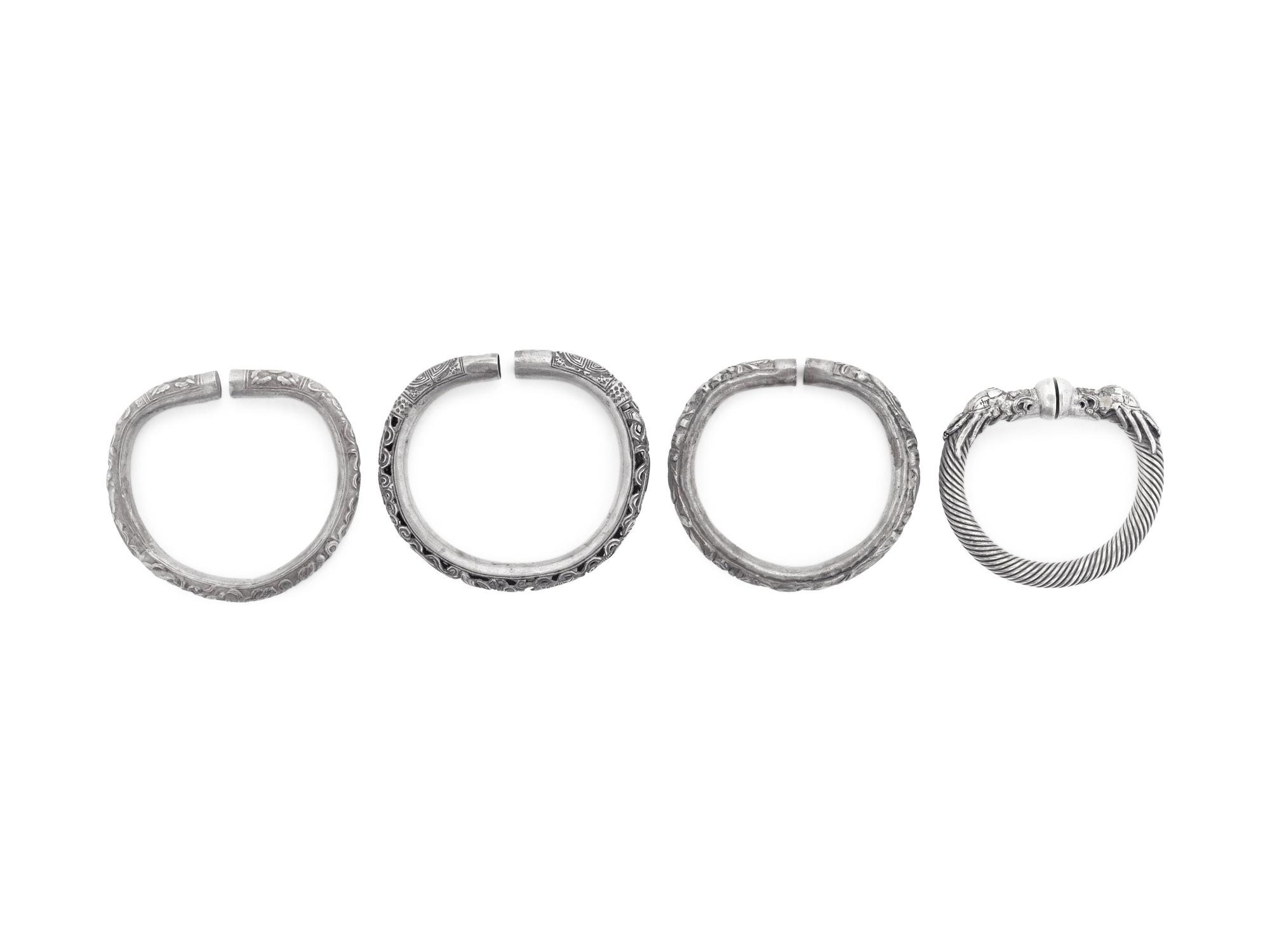 Four Chinese Silvered Metal Bangles