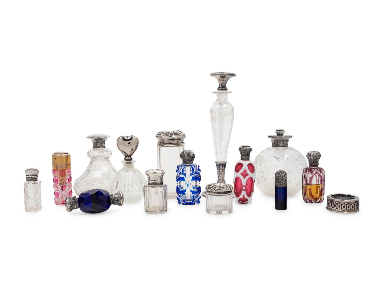A Collection of Silver Mounted Glass Jars and Perfume Bottles