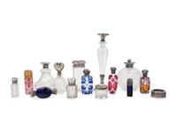 A Collection of Silver Mounted Glass Jars and Perfume Bottles