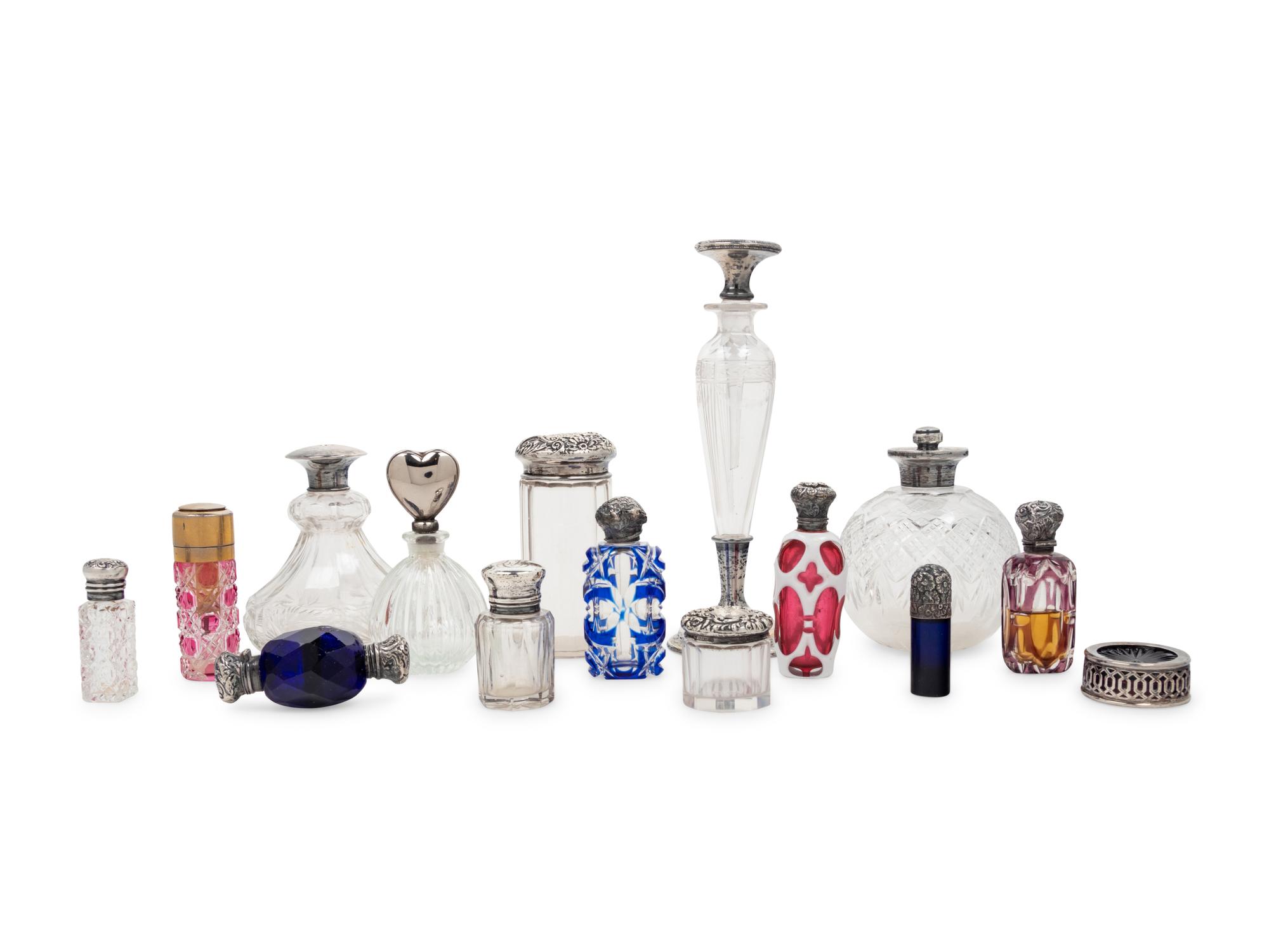A Collection of Silver Mounted Glass Jars and Perfume Bottles