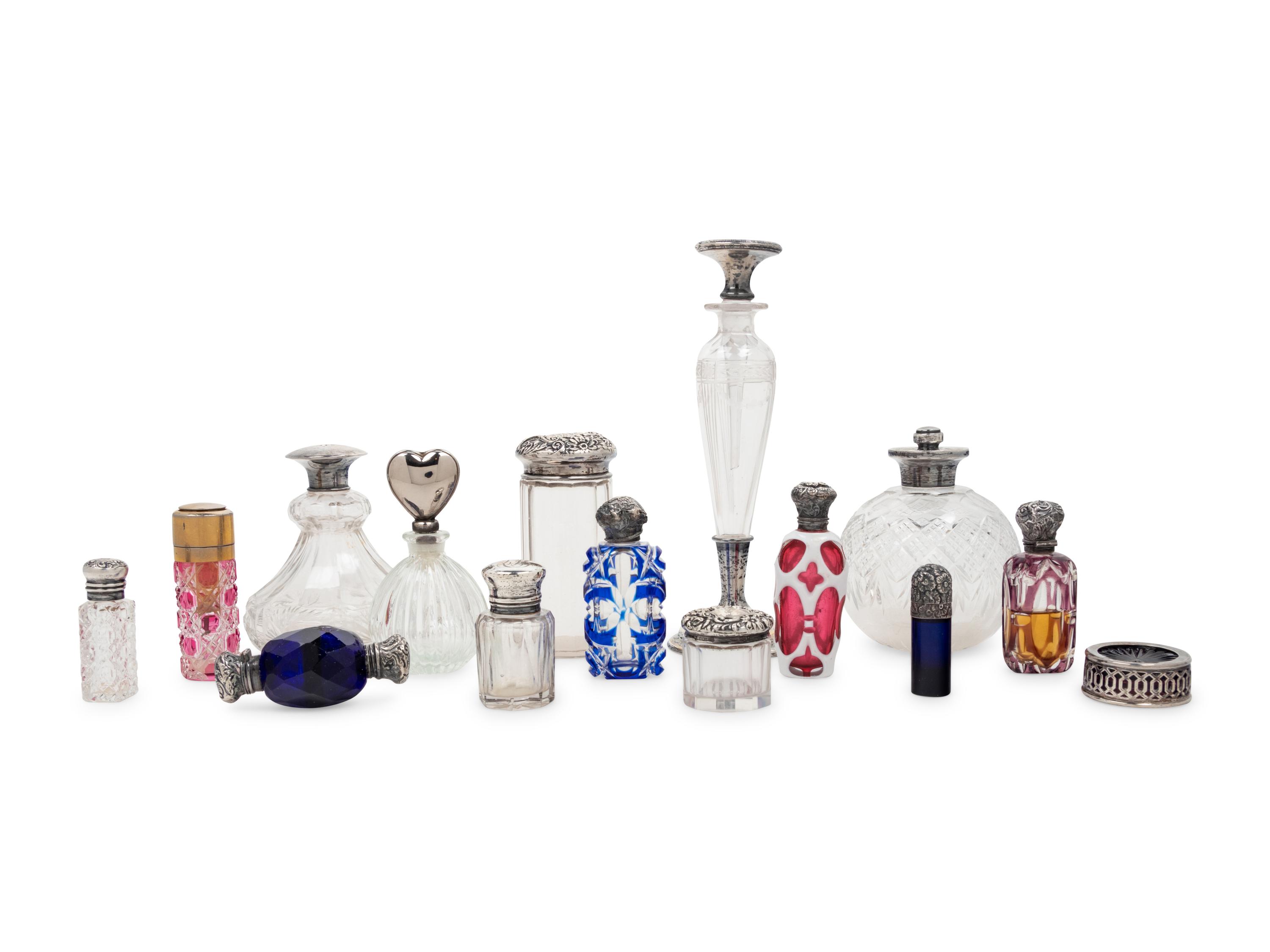A Collection of Silver Mounted Glass Jars and Perfume Bottles