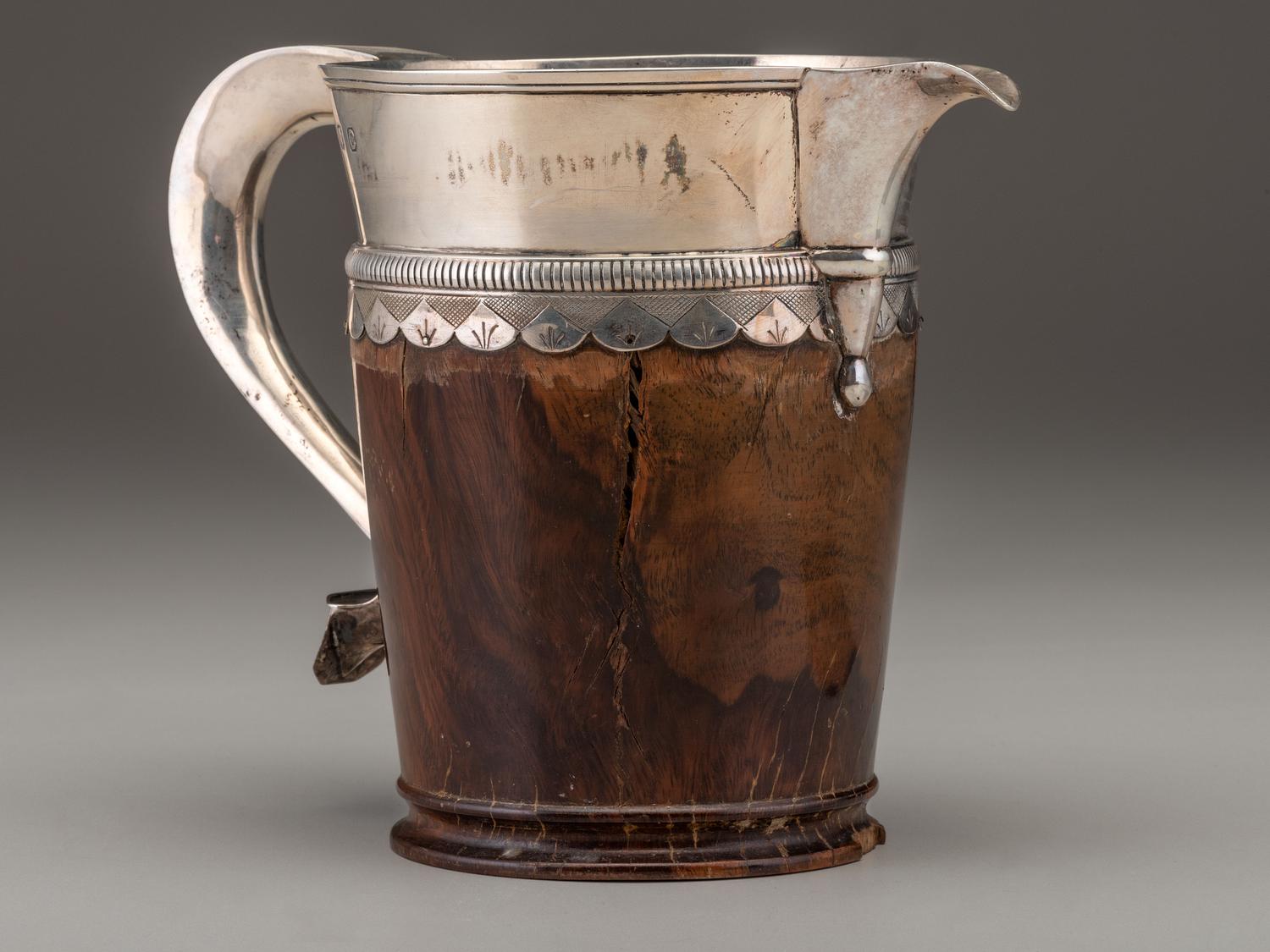 A Silver Mounted Mahogany Pitcher and Six Cups