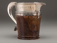 A Silver Mounted Mahogany Pitcher and Six Cups