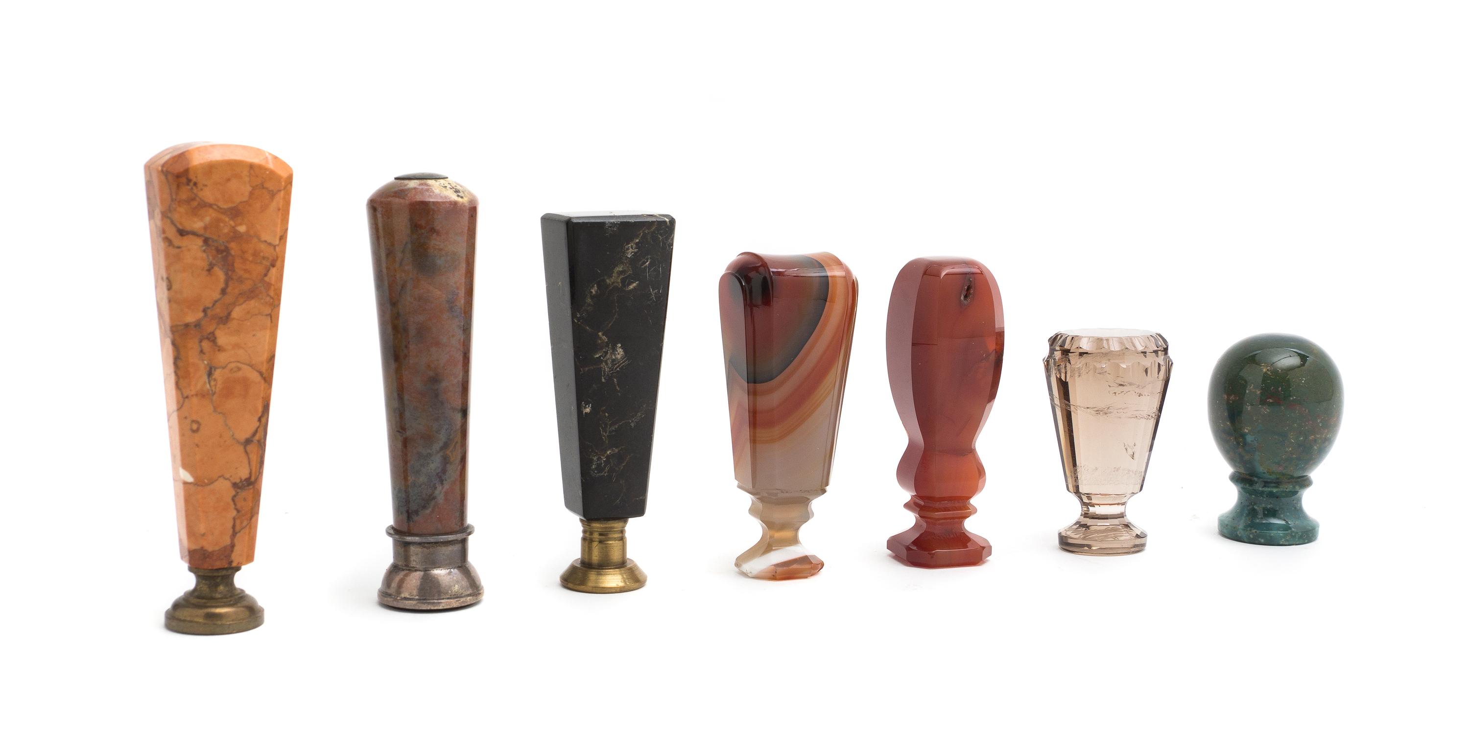 A Collection of Faceted Hardstone and Glass Seals, Height of tallest 4 3/8 inches.