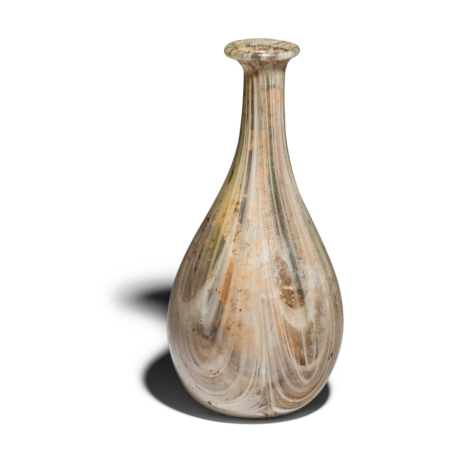 A Roman Marbled Pale Green and White Glass Bottle