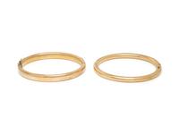 COLLECTION OF YELLOW GOLD BANGLE BRACELETS