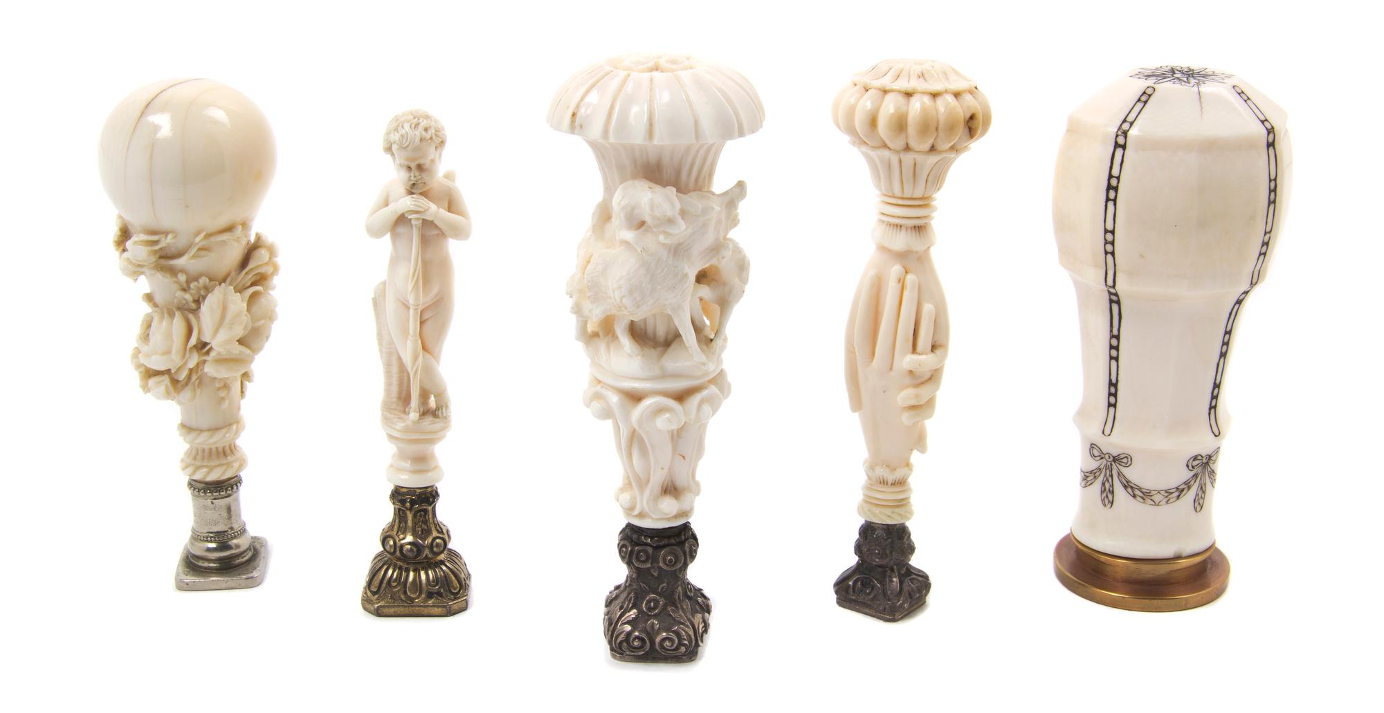 A Collection of Five Continental Carved Ivory Seals, Height of tallest 4 1/4 inches.