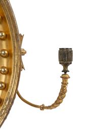 A Regency Parcel Ebonized Giltwood Convex Girandole Mirror