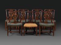 A Set of Six Chippendale Style Carved Mahogany Dining Chairs