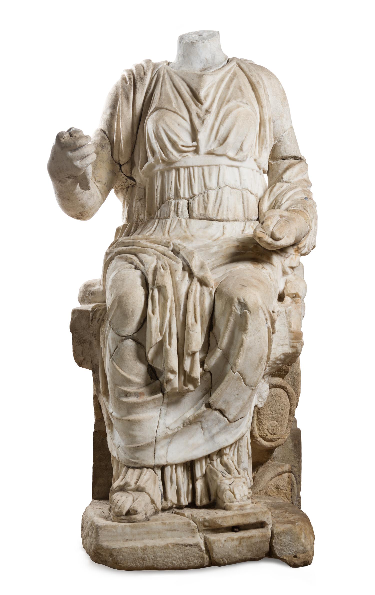 A Roman Marble Figure Height 52 x width 27 x depth 37 1/2 inches. — CIRCA 2ND CENTURY C.E. WITH LATER ELEMENTS
