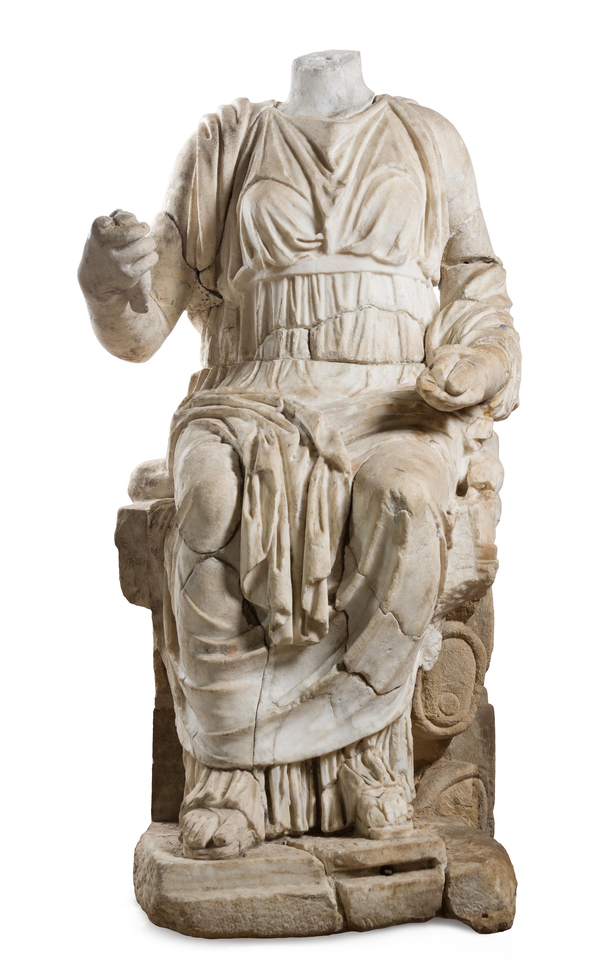 A Roman Marble Figure Height 52 x width 27 x depth 37 1/2 inches. — CIRCA 2ND CENTURY C.E. WITH LATER ELEMENTS