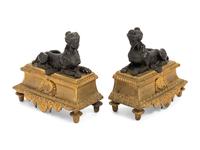 A Pair of Louis XVI Style Gilt and Patinated Bronze Chenets with Sphinxes