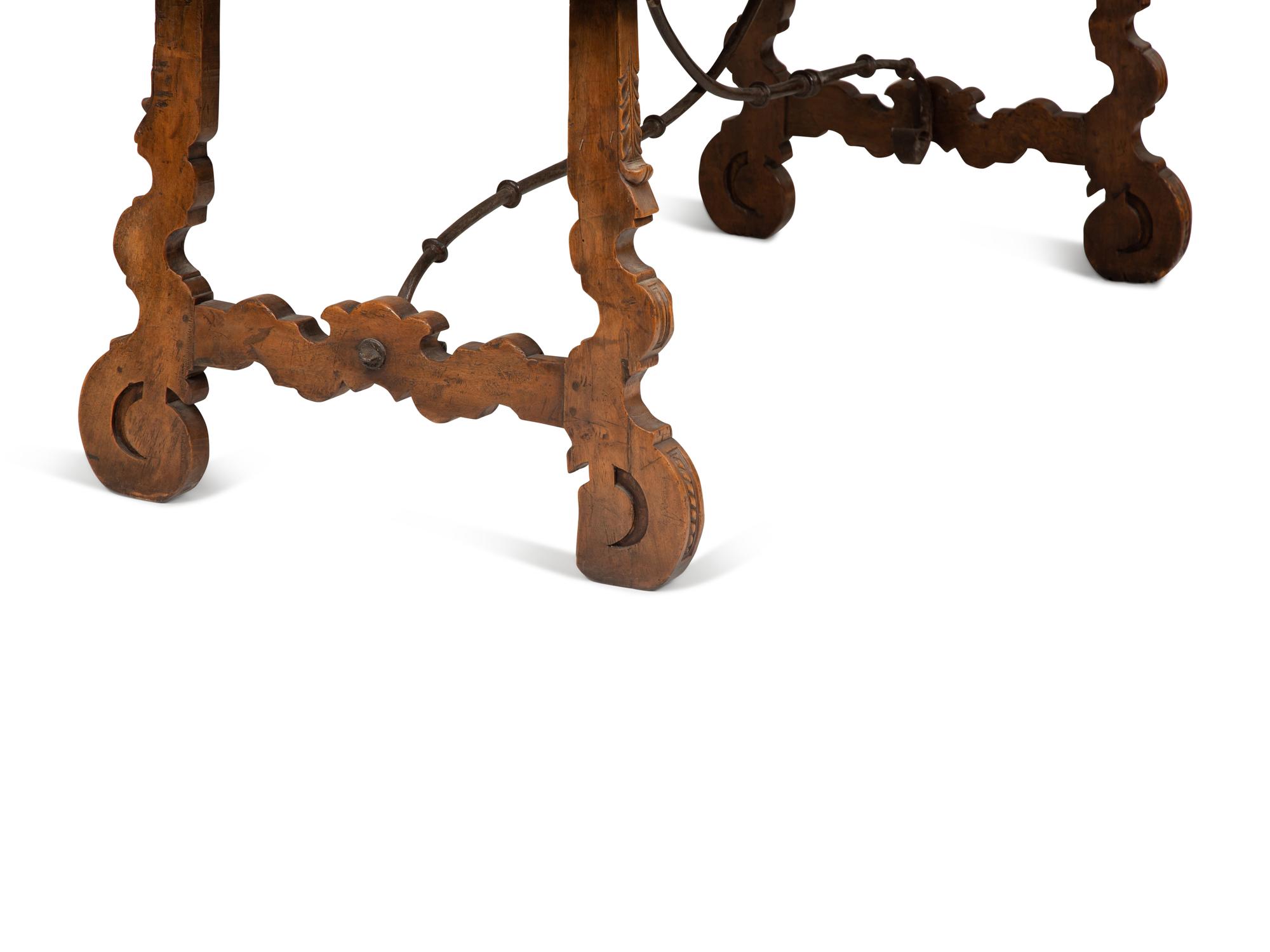 A Spanish Walnut and Wrought Iron Trestle Table