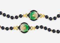 An 18K Yellow Gold and Black Onyx Bead Necklace