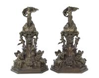 A Pair of Continental Bronze Bronze Chenets, Height 36 inches.