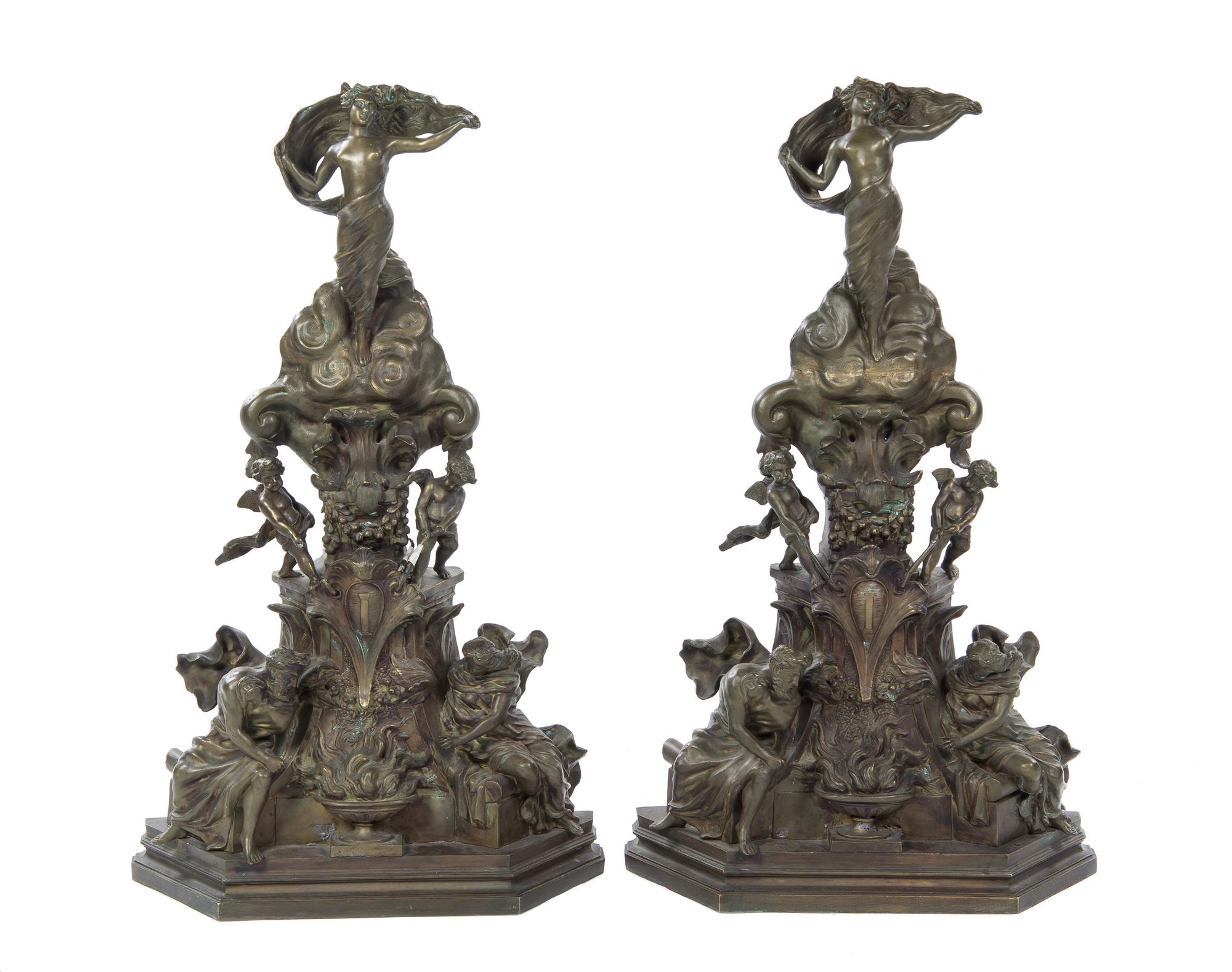 A Pair of Continental Bronze Bronze Chenets, Height 36 inches.