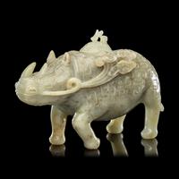 A Chinese Carved Celadon Jade Archaistic Rhinoceros-Form Covered Vessel, 20th Century 近代 青玉仿古犀尊
