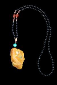 A Yellow and Celadon Jadeite Pendant Length 2 1/8 inches. — 20TH CENTURY