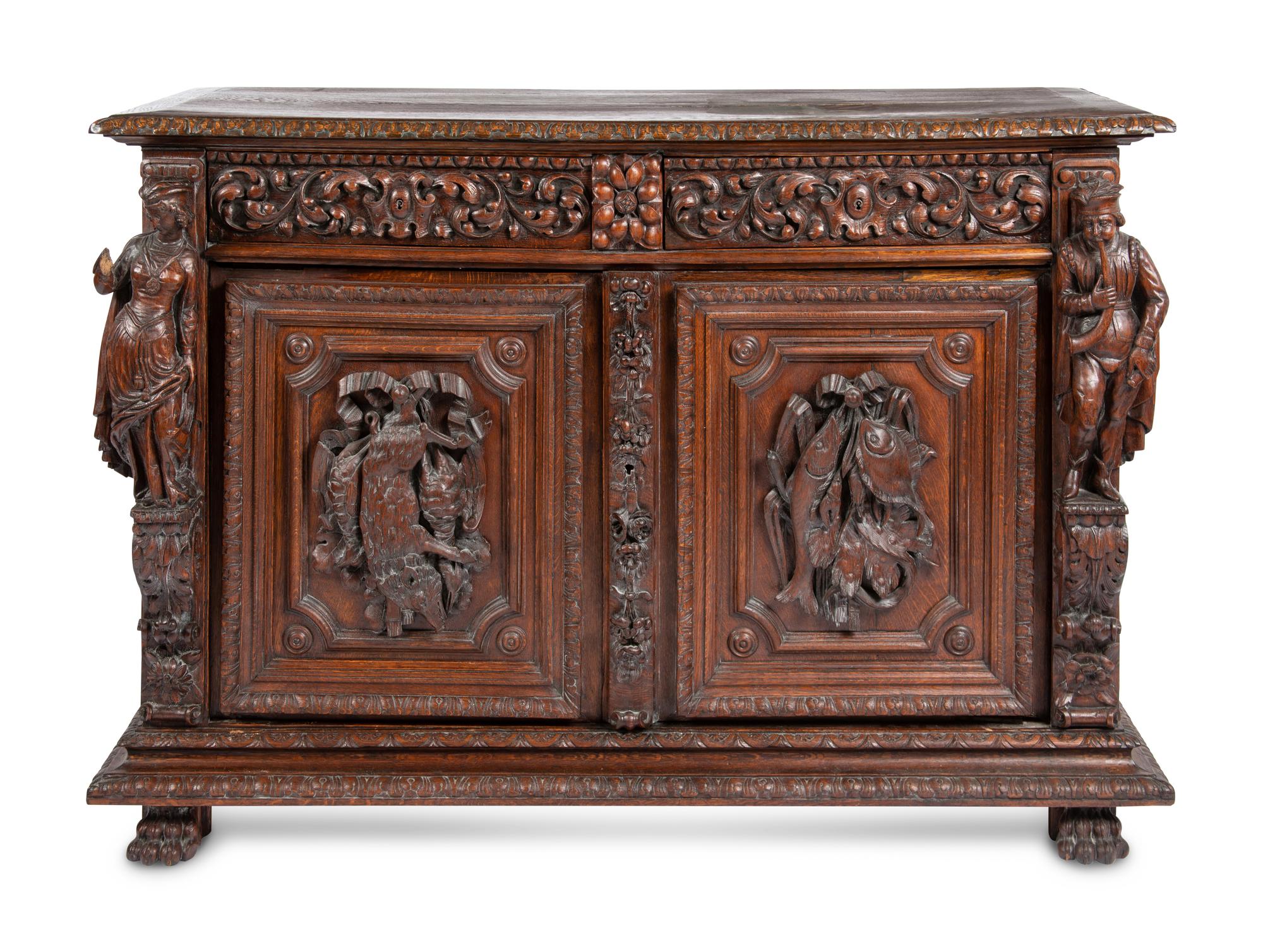 A Continental Carved Oak Cabinet