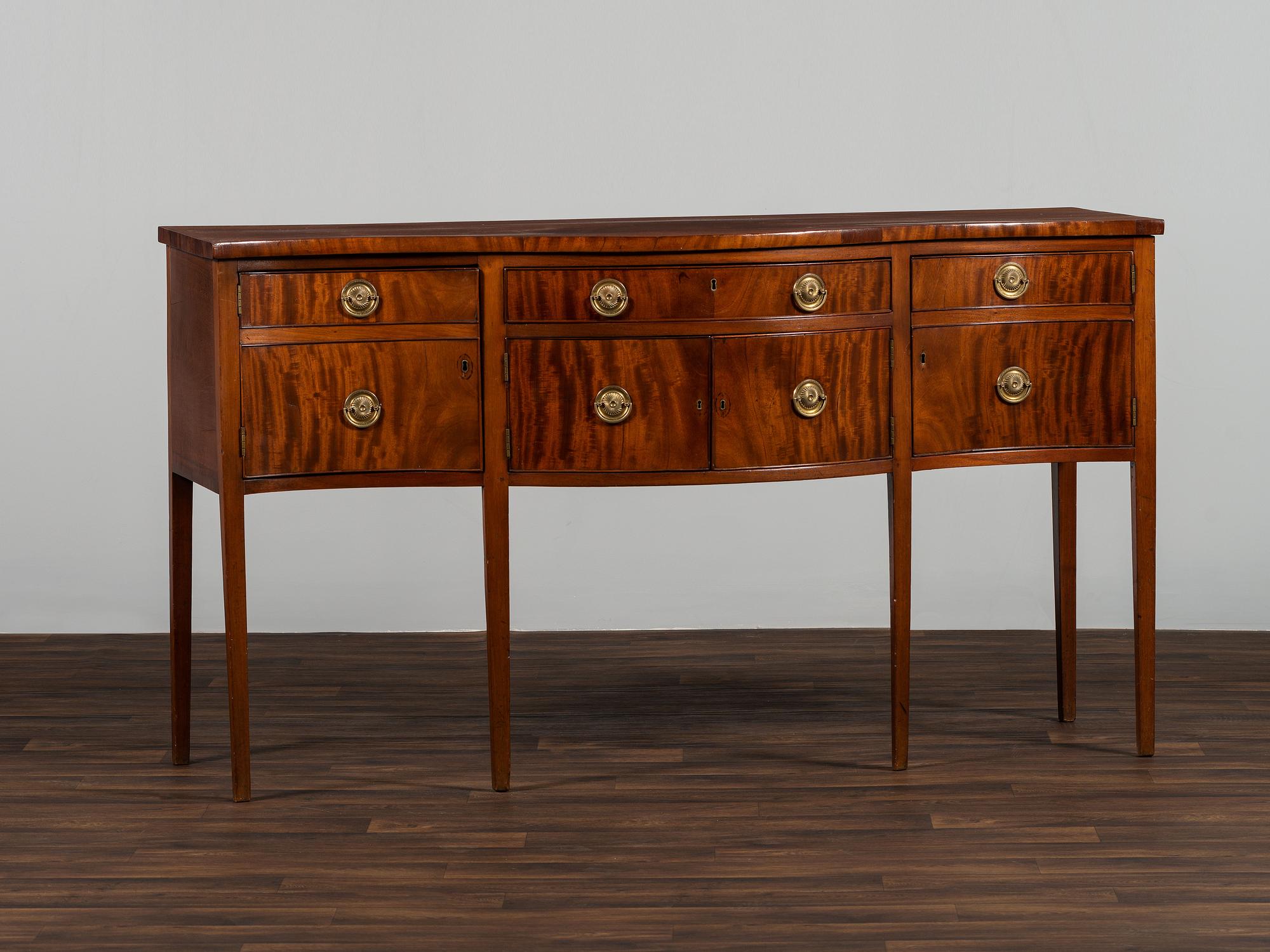 A Federal Figured Mahogany Serpentine Sideboard