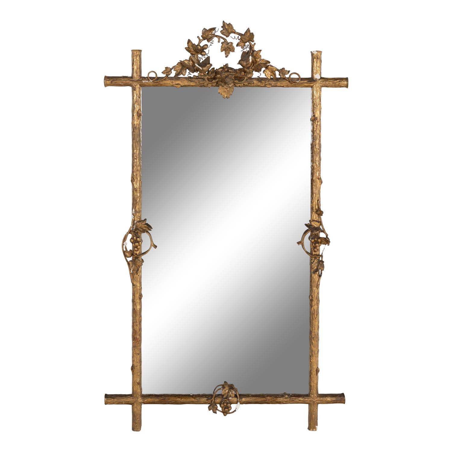 A Continental Carved Giltwood and Gesso Mirror