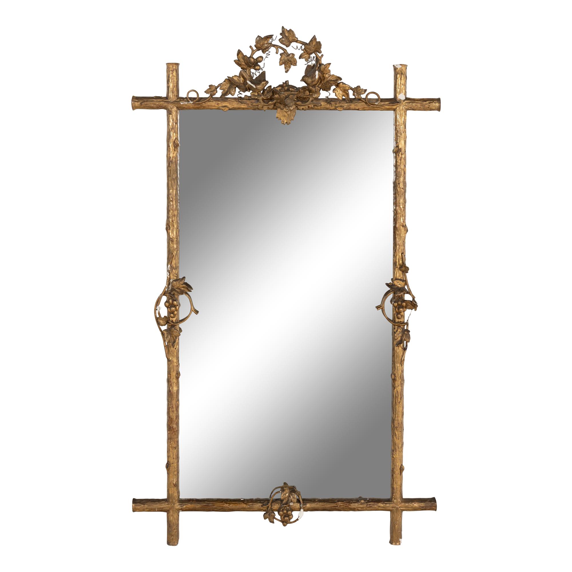 A Continental Carved Giltwood and Gesso Mirror