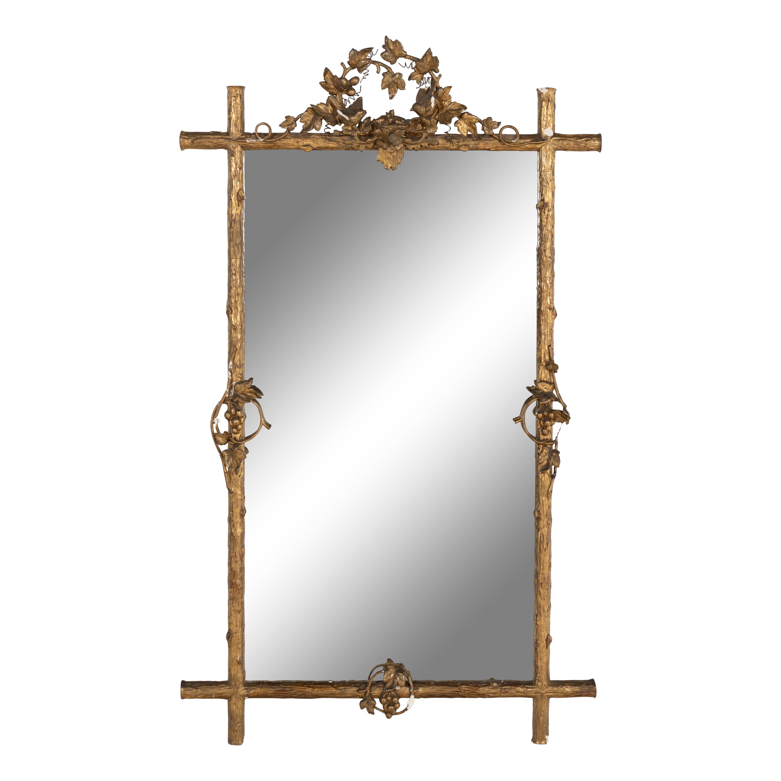 A Continental Carved Giltwood and Gesso Mirror