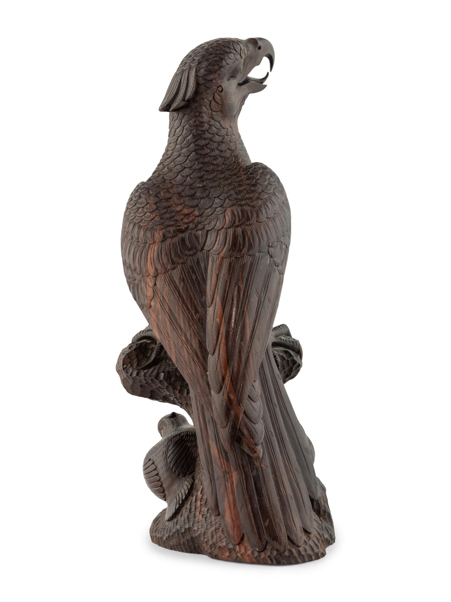 A Japanese Style Carved Rosewood Hawk with Chicks