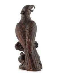 A Japanese Style Carved Rosewood Hawk with Chicks