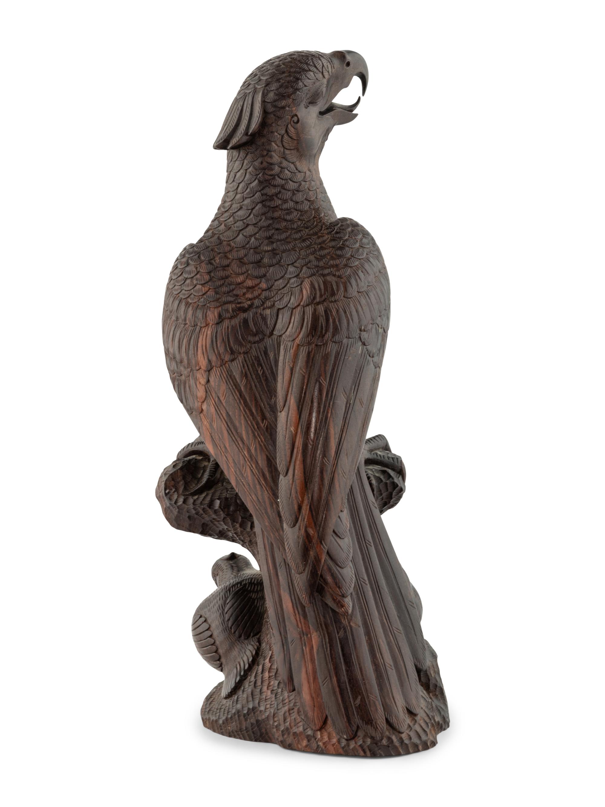 A Japanese Style Carved Rosewood Hawk with Chicks