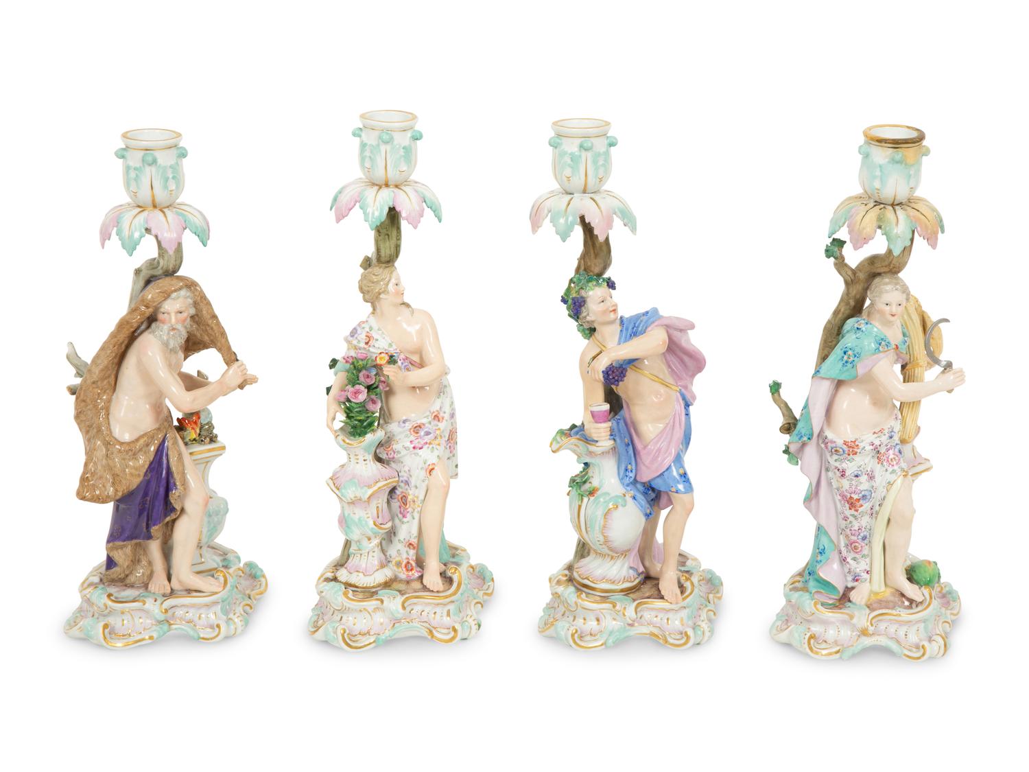 A Set of Meissen Porcelain Four Seasons Candlesticks