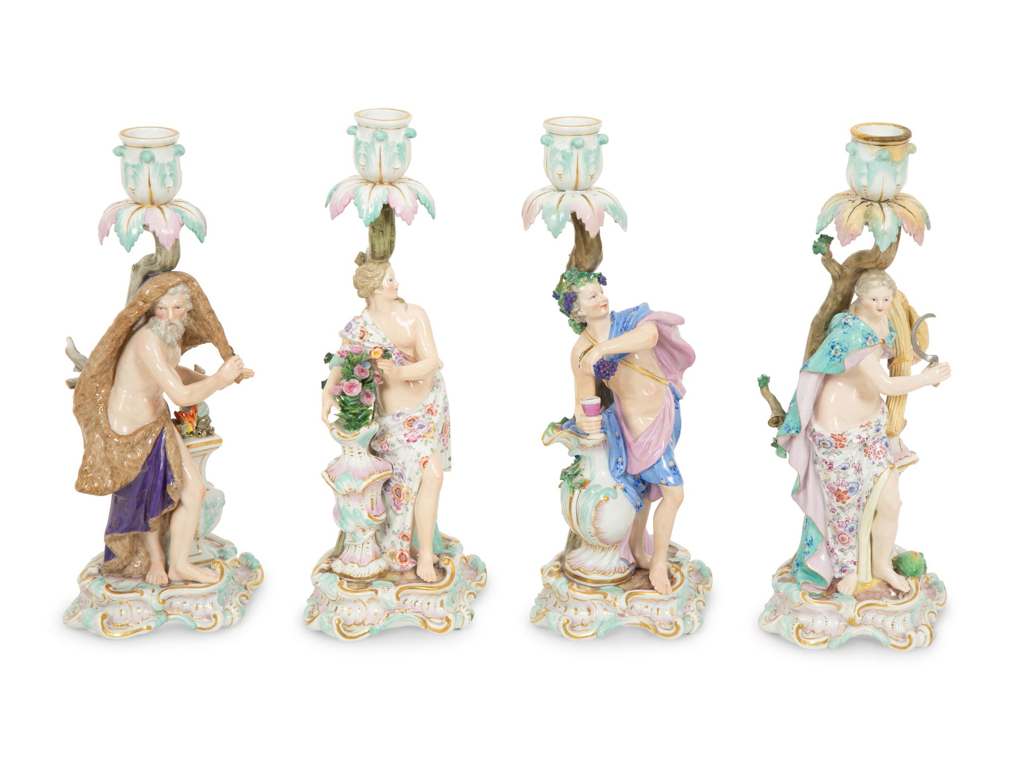 A Set of Meissen Porcelain Four Seasons Candlesticks