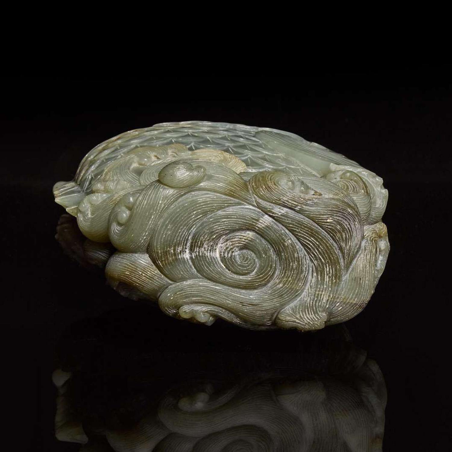 A Chinese carved celadon jade figure of a leaping carp 青玉鯉躍龍門花插