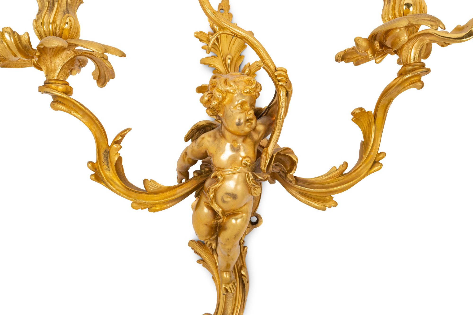 A Pair of Louis XV Style Gilt Bronze Figural Three-Light Sconces