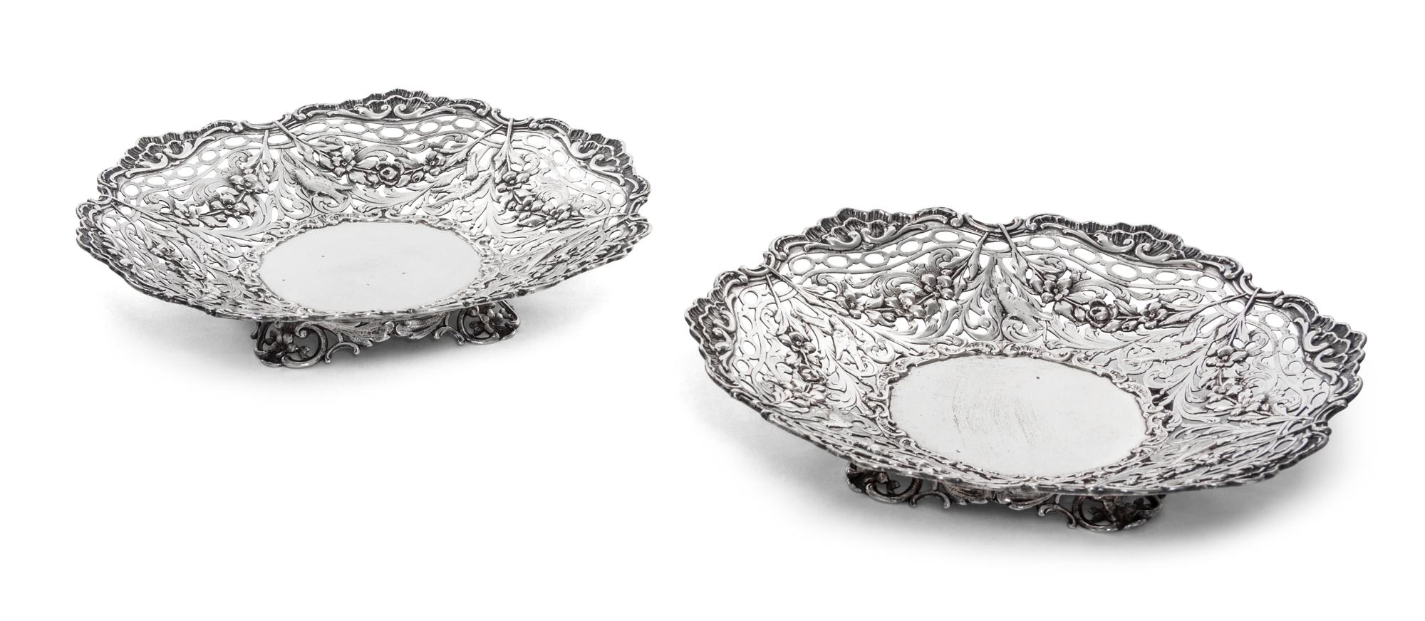 A Pair of Continental Silver Bowls, Maker's Mark HSS centering a star, each having pierced sides decorated with foliate scrolls, fruit